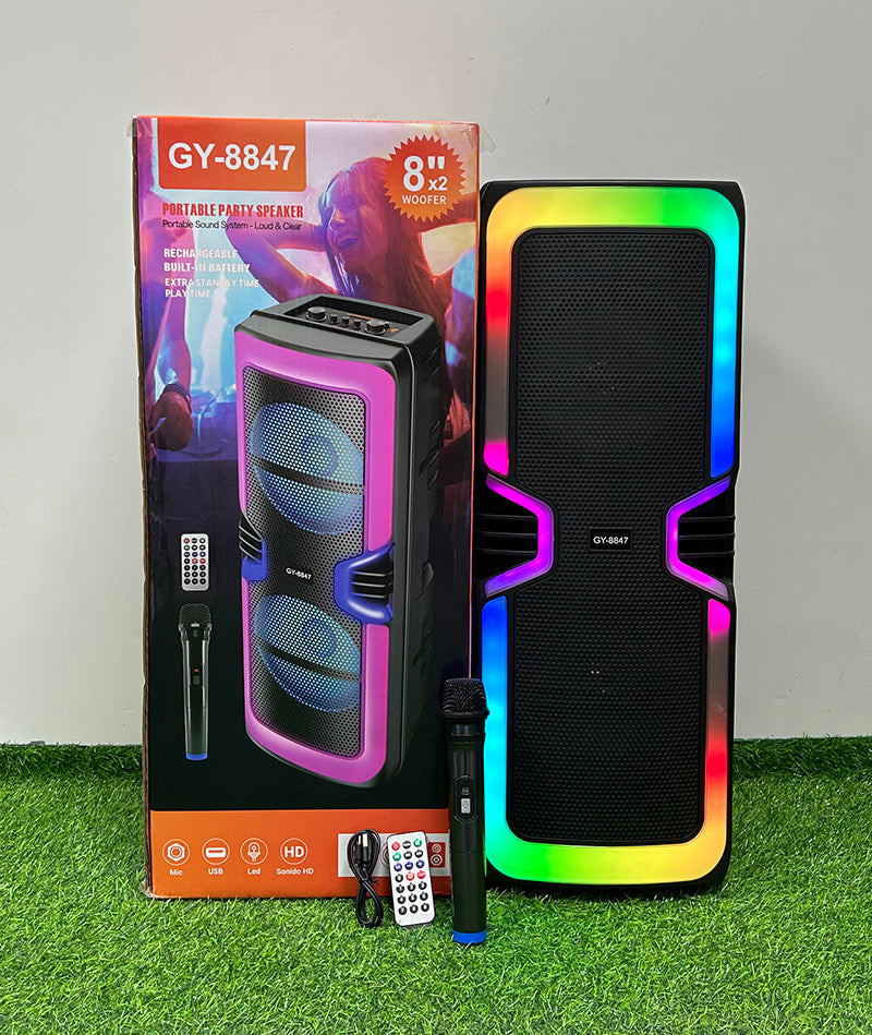 GY-8847 altoparlant Bluetooth portativ me drita RGB LED, mikrofon pa tela, Bluetooth 5.0, radio FM, mbështetje për kartë TF, bateri 2000–3000mAh dhe telekomandë. Ideal për karaoke, festa, evente dhe përdorim në shtëpi.